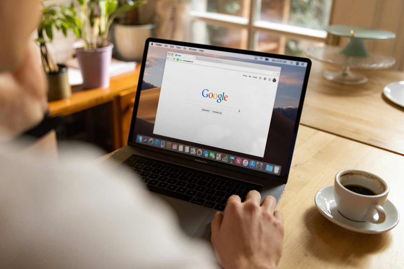 Searching Google on a laptop at a kitchen table